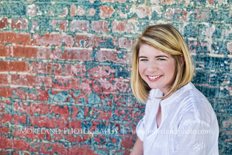 High school senior smiling with her back to a brick wall, Roswell Senior Photography, Atlanta Senior Portraits, Senior Photography, Atlanta Senior Photography, Moreland Photography, Mike Moreland, Class of 2016, mikemoreland, morelandphoto, excitement, class of 2016, country girl, sparkling future, big grin, posing by wall