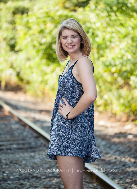 High school senior posing on abandoned railroad tracks, Roswell Senior Photography, Atlanta Senior Portraits, Senior Photography, Atlanta Senior Photography, Moreland Photography, Mike Moreland, Class of 2016, mikemoreland, morelandphoto, excitement, class of 2016, country girl, sparkling future, big grin, posing by train tracks, mixed color blouse, model portrait, afternoon, sassy and classy