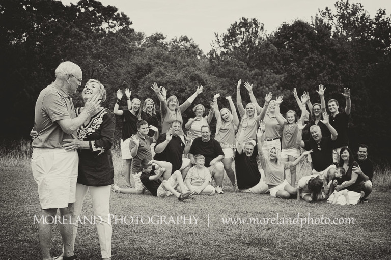 schroll family, love, jovial, smiles, posing for happiness, posing outside, posing large families, schroll couple dancing, black and white photography, mikemoreland, morelandandphoto, schroll family, celebration, her eyes, laughter, everlasting promise, celebratory posing, kiss her