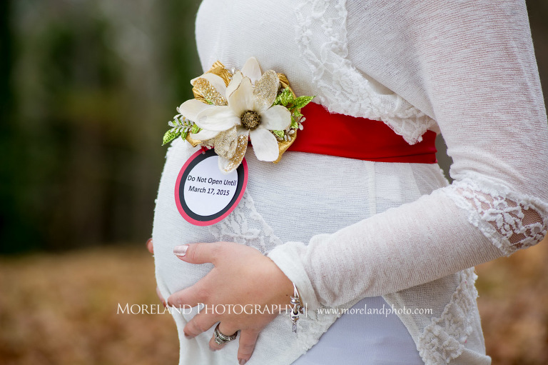 Pregnant woman's belly with a sign displaying the delivery, beautiful, serene, love, joy, happiness, classic, timeless
