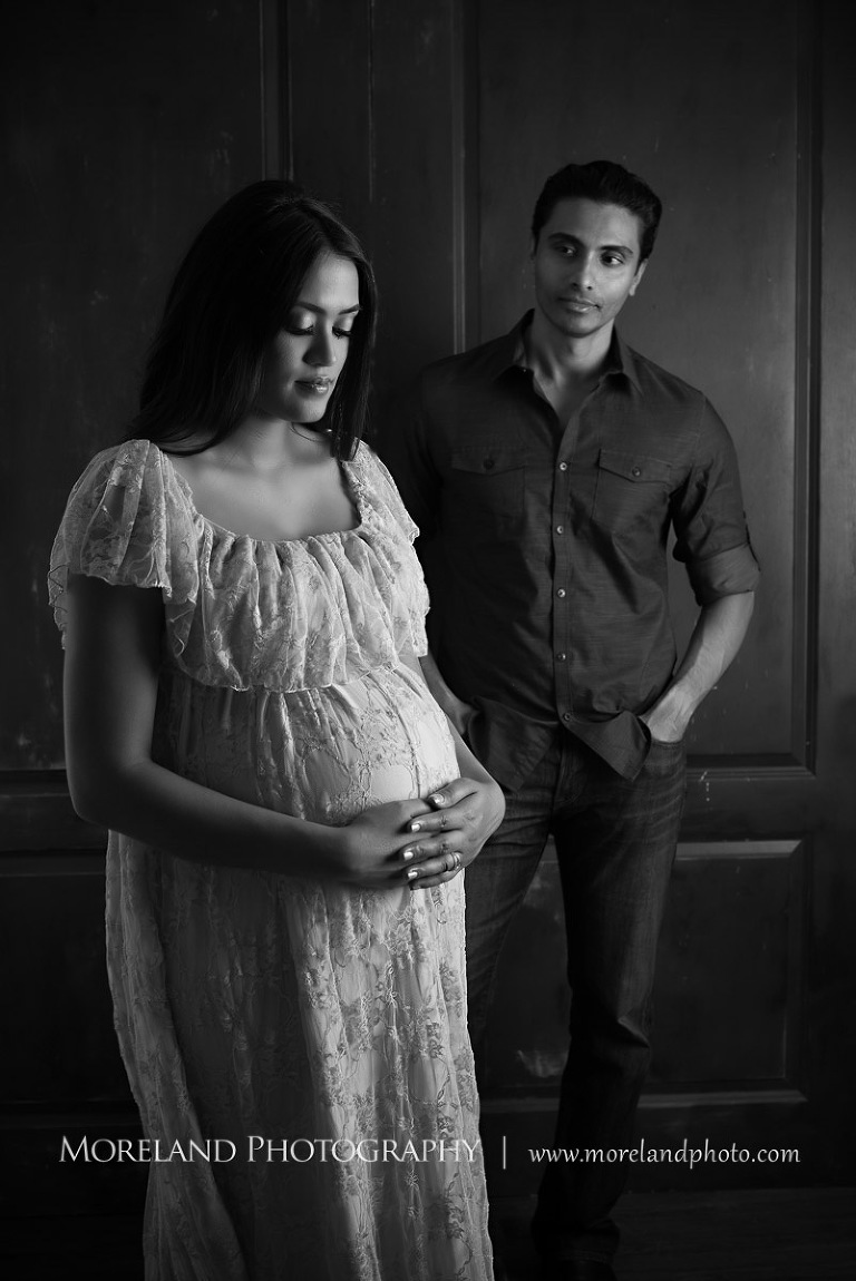 Gray scale image of husband looking at his wife while she looks at her pregnant belly, love, peaceful, beautiful, joy, happiness, expecting, unsuspecting