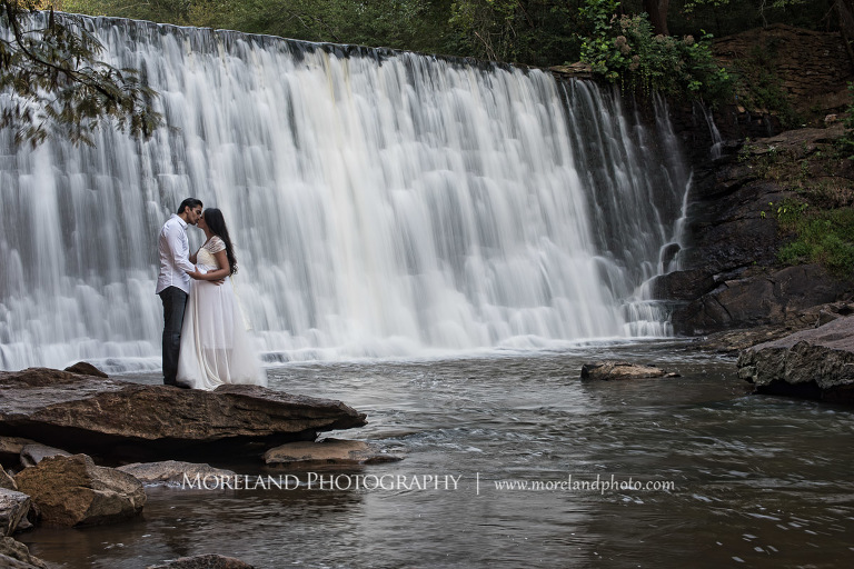 Indian husband kissing his pregnant indian wife by a waterfall, beautiful, love, adoration, nature, natural, joy, romance, peaceful, protection, serene