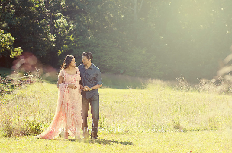 Indian couple expecting a baby walking through an open meadow, outdoor maternity, naturalistic maternity, beautiful, love, adoration, nature, natural, joy, romance, peaceful, protection, serene