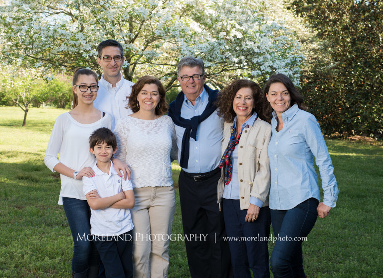 Family portrait of six standing togther outside in front of a white floral tree during the daytime, Family Moreland Photography, Atlanta Portrait Photographer, Atlanta Child Photographer, Atlanta Family Photographer, Moreland Photography, Mike Moreland