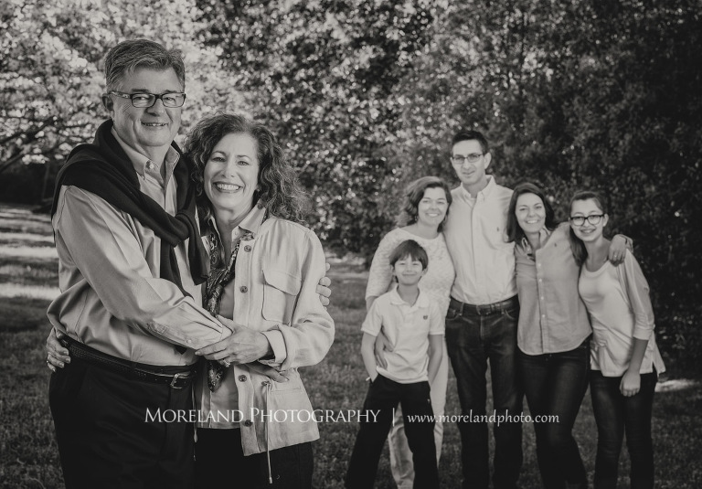 Black and white portrait of a smiling family of six standing outisde during the daytime with the grandparents being the main focus, Family Moreland Photography, Atlanta Portrait Photographer, Atlanta Child Photographer, Atlanta Family Photographer, Moreland Photography, Mike Moreland
