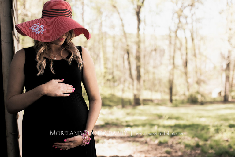 Pregnant woman holding her stomach as she stood by a barn, Nature Maternity, Atlanta Maternity Photographer, Maternity Photos Atlanta, Georgia Maternity Photography, Moreland Photography, Mike Moreland, Outdoor Maternity, Maternity on the River, 
