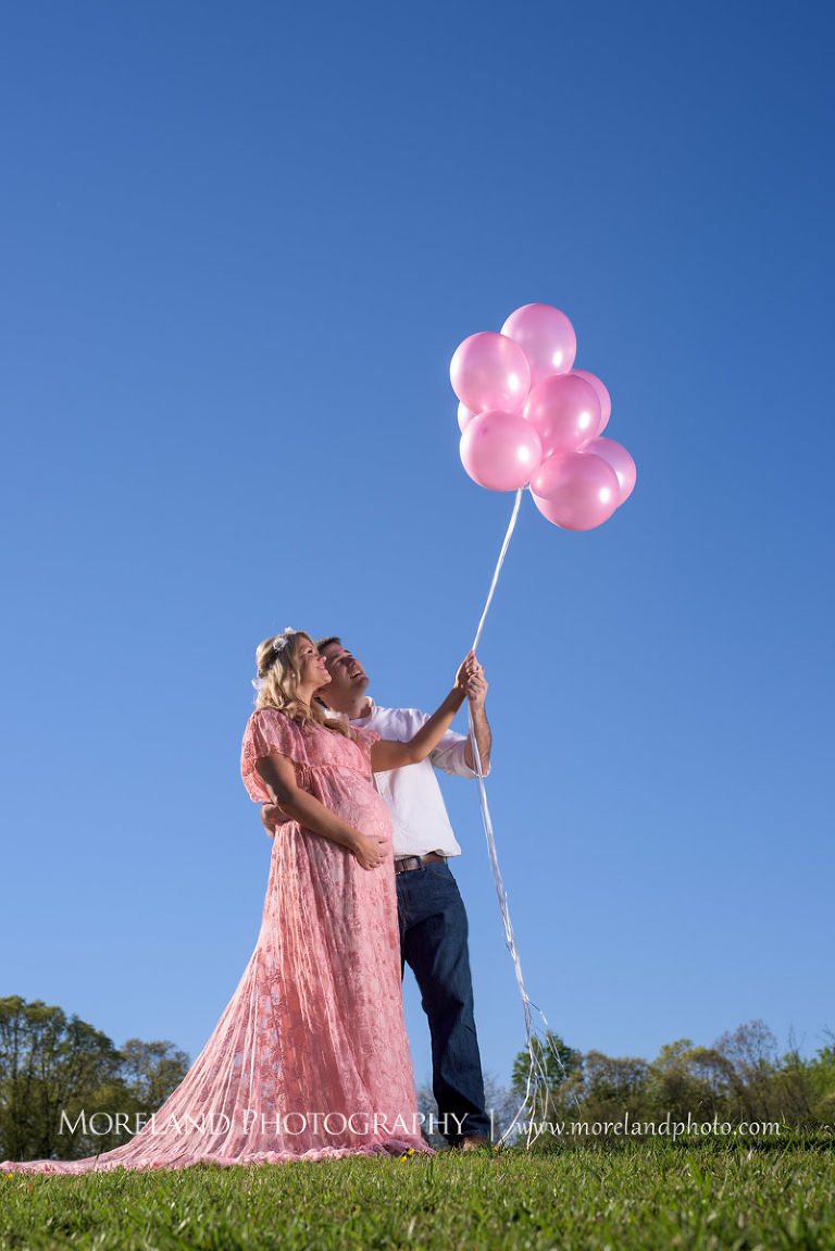 Husband and wife hold pink balloons to the sky, Atlanta Maternity Photographer, Maternity Photos Atlanta, Georgia Maternity Photography, Moreland Photography, Mike Moreland, Outdoor Maternity, Maternity on the River, 