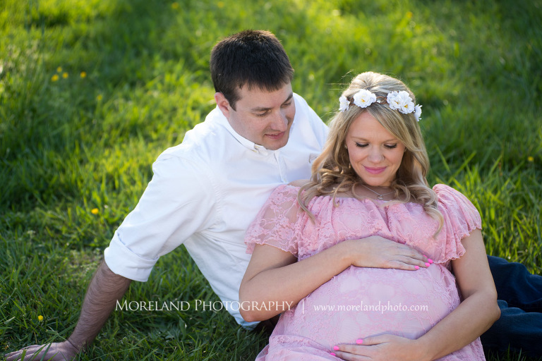 Husband and pregnant wife sitting on the grass looking at her belly, Atlanta Maternity Photographer, Maternity Photos Atlanta, Georgia Maternity Photography, Moreland Photography, Mike Moreland, Outdoor Maternity, Maternity on the River, 