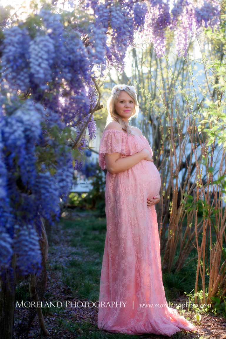 Pregnant woman touching her belly as she stands by purple flowers, Nature Maternity, Atlanta Maternity Photographer, Maternity Photos Atlanta, Georgia Maternity Photography, Moreland Photography, Mike Moreland, Outdoor Maternity, Maternity on the River, 