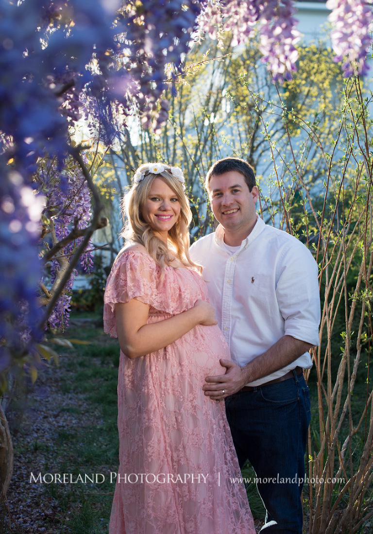 Pregnant wife and her husband standing by purple flowers, Atlanta Maternity Photographer, Maternity Photos Atlanta, Georgia Maternity Photography, Moreland Photography, Mike Moreland, Outdoor Maternity, Maternity on the River, 