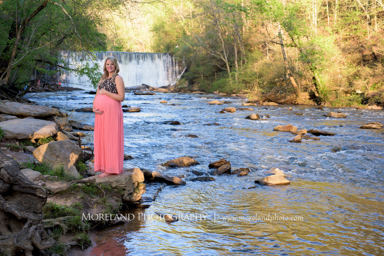 Pregnant woman wearing a pink dress on a rock with a waterfall in the background, Atlanta Maternity Photographer, Maternity Photos Atlanta, Georgia Maternity Photography, Moreland Photography, Mike Moreland, Outdoor Maternity, Maternity on the River, 