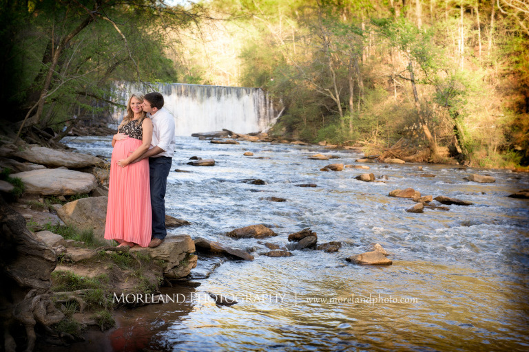 Nature Maternity, Husband holding his wife from behind as they stand on a rock with a waterfall in the background, Atlanta Maternity Photographer, Maternity Photos Atlanta, Georgia Maternity Photography, Moreland Photography, Mike Moreland, Outdoor Maternity, Maternity on the River, 