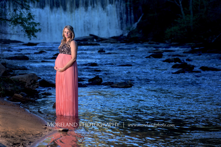 Pregnant woman standing in a river touching her stomach with a waterfall in the background, Atlanta Maternity Photographer, Maternity Photos Atlanta, Georgia Maternity Photography, Moreland Photography, Mike Moreland, Outdoor Maternity, Maternity on the River, 