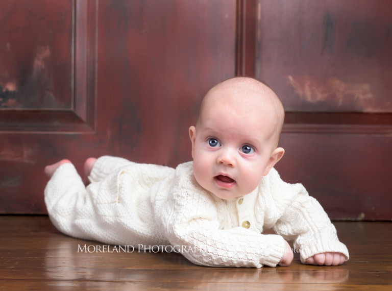 Baby laying on the floor on their stomach wearing a onesie, Atlanta Family Photography, Family Photographer Atlanta, Atlanta Photographer, Moreland Photography, Mike Moreland, Four kids, Large family, Fall Family Pictures, 