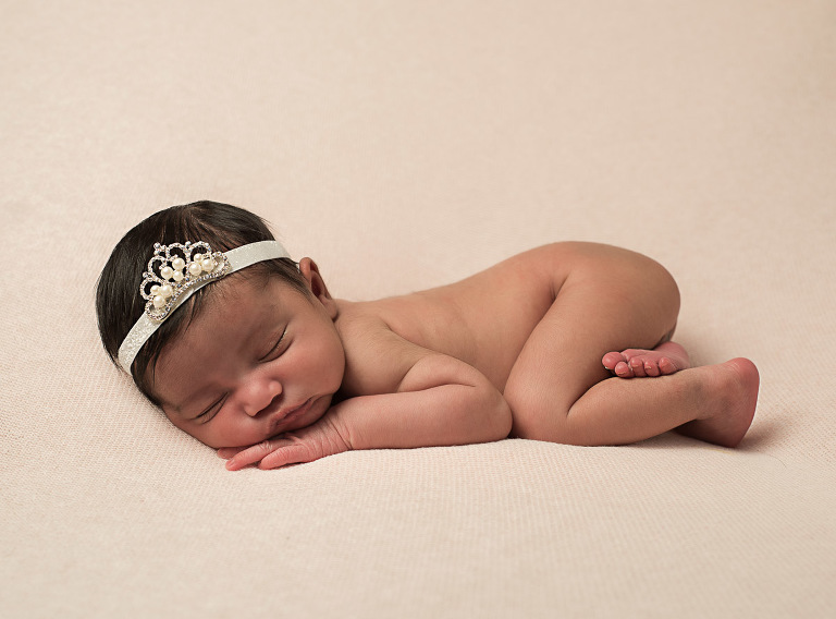 Newborn baby curled up asleep on their stomach, Atlanta Newborn Photographer, Atlanta Newborn Photography, Moreland Photography, Mike Moreland, newborn studio photography, bundle of joy, newborn, little angel, tot, girl, kid, buttercup, innocent, happiness