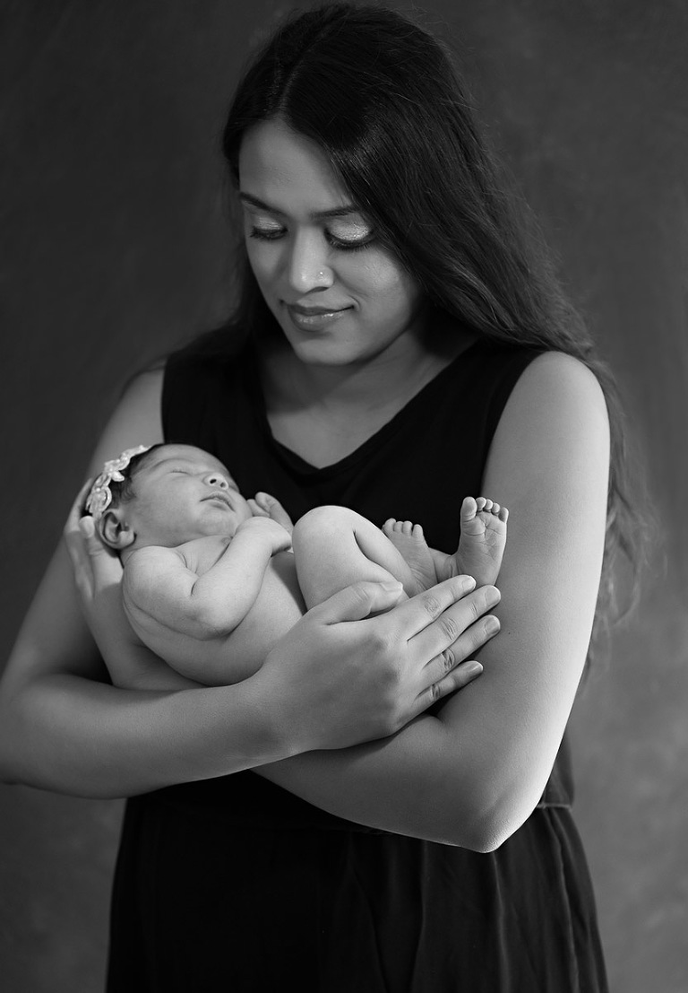 Mother cradling her newborn baby girl, Atlanta Newborn Photographer, Atlanta Newborn Photography, Moreland Photography, Mike Moreland, bundle of joy, newborn, little angel, tot, girl, kid, buttercup, innocent, happiness