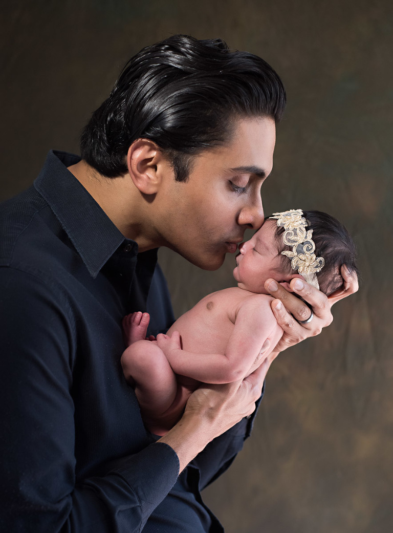 Father holding his newborn baby girl while kissing her nose, bundle of joy, Atlanta Newborn Photographer, Atlanta Newborn Photography, Moreland Photography, Mike Moreland, newborn, little angel, tot, girl, kid, buttercup, innocent, happiness