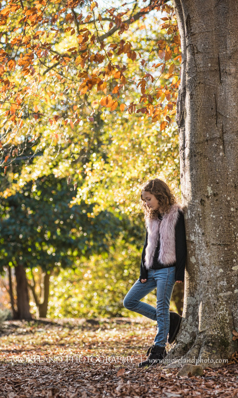 Portrait of little girl leaning on tree outside in the daytime during the fall season, Atlanta Portrait Photographer, Atlanta Child Photographer, Atlanta Family Photographer, Moreland Photography, Mike Moreland