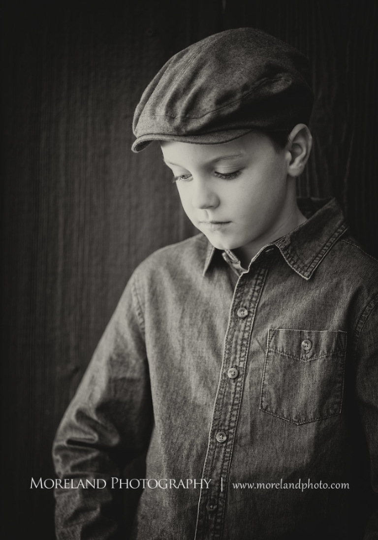 Grey-scale image of a young boy wearing a cabbie hat while staring down, Atlanta Newborn Photography, Newborn Photographer Atlanta, Birth Photography, Natural Birth Photography, Hospital Photographer, Moreland Photography, Mike Moreland