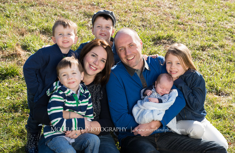 Medium close-up of a happy couple surrounded by their four children while holding their new addition to the family, Family Newborn Photography, Atlanta Newborn Photography, Newborn Photographer Atlanta, Birth Photography, Natural Birth Photography, Hospital Photographer, Moreland Photography, Mike Moreland