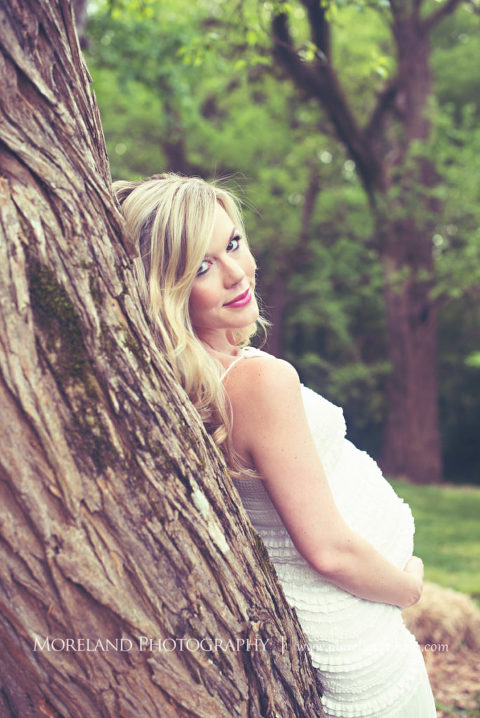 outdoor maternity shoot, Portrait of pregnant woman looking back at camera laying against a tree, Maternity Photography, Atlanta Maternity, Lifestyle Maternity Photography, Styled Maternity Shoot, Moreland Photography, Mike Moreland, Outdoor Maternity, Nature Maternity, 