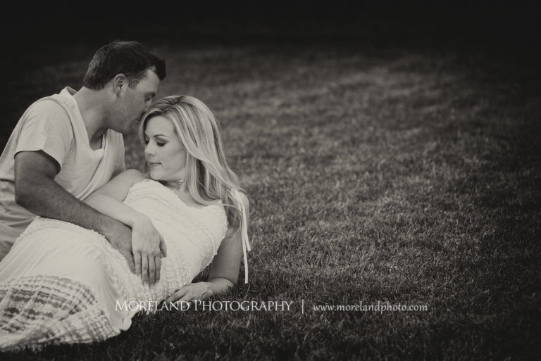 Black and white portrait of pregnant couple laying in the grass holding each other, Maternity Photography, Atlanta Maternity, Lifestyle Maternity Photography, Styled Maternity Shoot, Moreland Photography, Mike Moreland, Outdoor Maternity, Nature Maternity, 