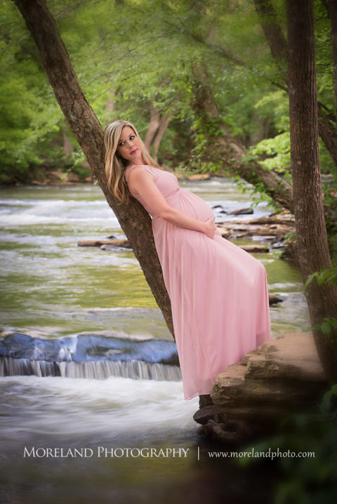 Portrait of pregnant woman holding her belly leaning against a tree in front of a river, Maternity Photography, Atlanta Maternity, Lifestyle Maternity Photography, Styled Maternity Shoot, Moreland Photography, Mike Moreland, Outdoor Maternity, Nature Maternity, 