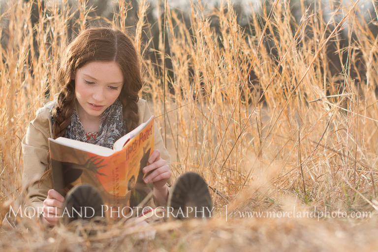 girl reading in open field of tall grass, Childen Ballet, Child Portraits, Atlanta Photgraphy, Moreland Photography, Roswell Portraits, ballet shoes, dancer, Harry Potter, reading,