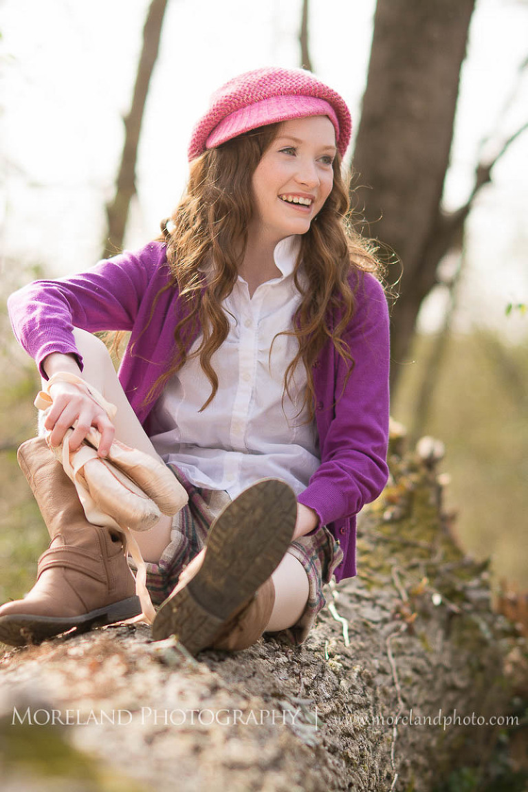 ballerina sitting on log wearing a pink hat and purple sweater, Childen Ballet, Child Portraits, Atlanta Photgraphy, Moreland Photography, Roswell Portraits, ballet shoes, dancer, 
