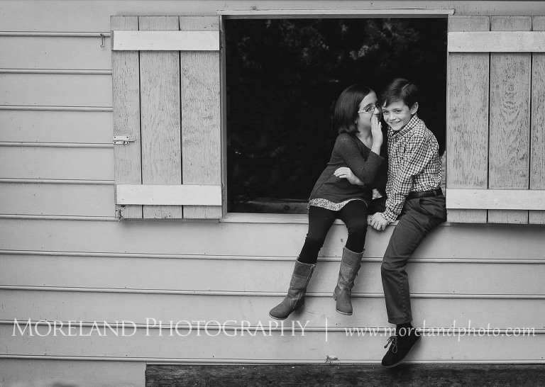 Little girl whispering in her brothers ear, Twin Portraits, Child Portraits, Atlanta Photgraphy, Moreland Photography, Roswell Portraits, twins, barn window,