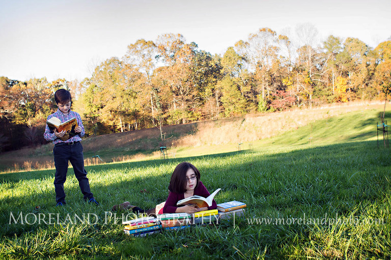 Brother and sister laying in field reading, Twin Portraits, Child Portraits, Atlanta Photgraphy, Lifestyle photography, Moreland Photography, Roswell Portraits, twins, tall grass, brother, sister, reading,
