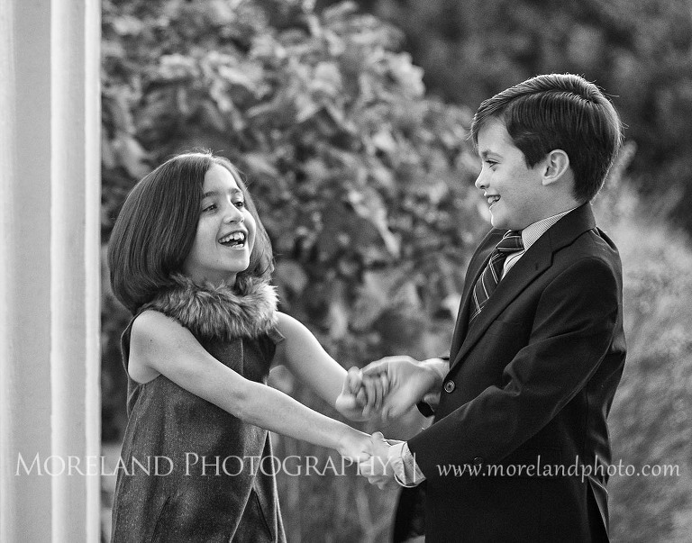 Twin sibling dancing together, Twin Portraits, Child Portraits, Atlanta Photgraphy, Lifestyle photography, Moreland Photography, Roswell Portraits, twins, tall grass, brother, sister, black and white,