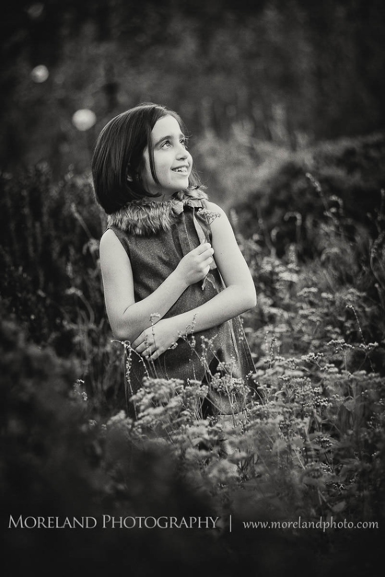 Little girl in black in white holding flowers, Twin Portraits, Child Portraits, Atlanta Photgraphy, Lifestyle photography, Moreland Photography, Roswell Portraits, twins, tall grass, brother, sister, black and white,