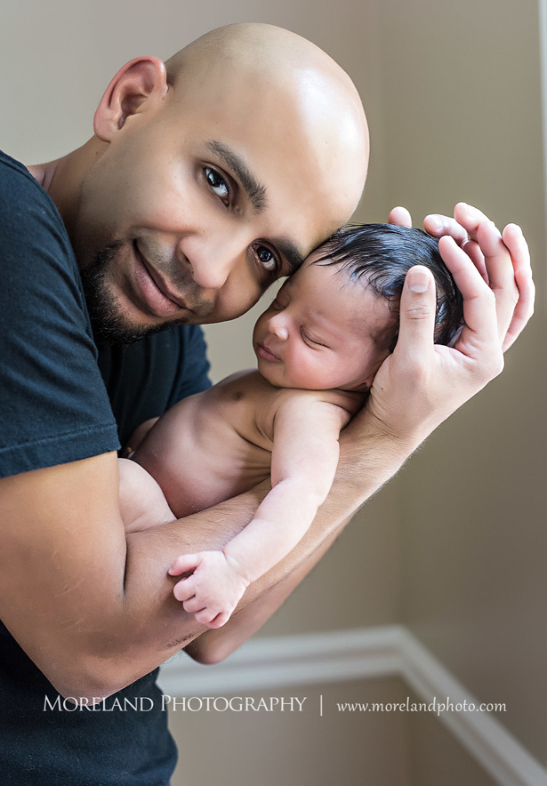 intimate newborn, baby, father holding infant in arms, newborn sleeping in fathers arms, father kissing sleeping infant, father loving baby, infant posing in fathers arms, Moreland Photography, atlanta newborn photography, newborn photographer atlanta, Puerto Rico newborn photography, 