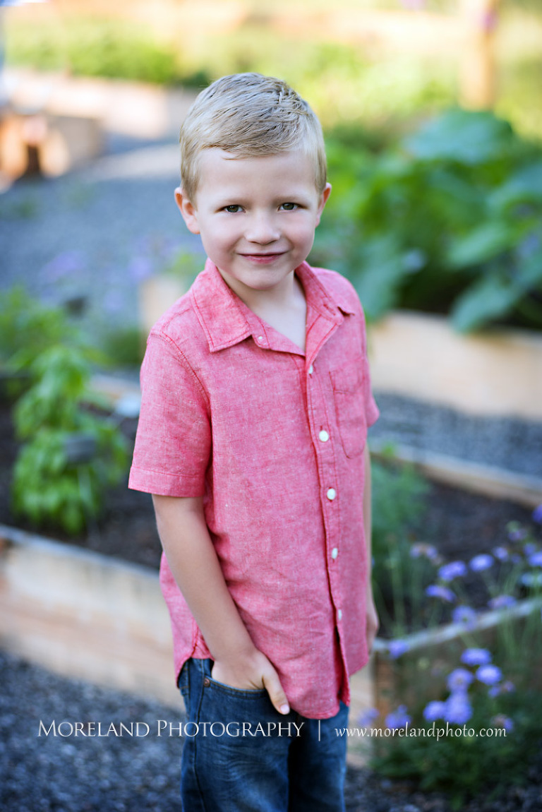 little boy in red button down smiling in garden, Mike Moreland, Moreland Photography, wedding photography, Atlanta wedding photography, detailed wedding photography, lifestyle wedding photography, Atlanta wedding photographer,
