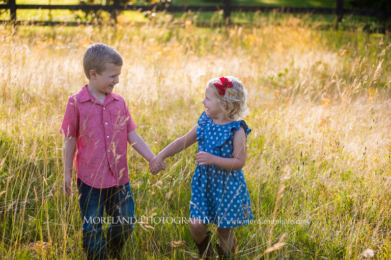 boy in red button down holding hands with sister in polka dot dress in a field, Mike Moreland, Moreland Photography, wedding photography, Atlanta wedding photography, detailed wedding photography, lifestyle wedding photography, Atlanta wedding photographer,