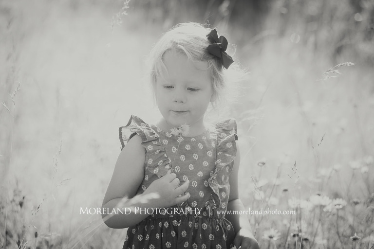 little girl blowing dandelion in a field black and white, Mike Moreland, Moreland Photography, wedding photography, Atlanta wedding photography, detailed wedding photography, lifestyle wedding photography, Atlanta wedding photographer,