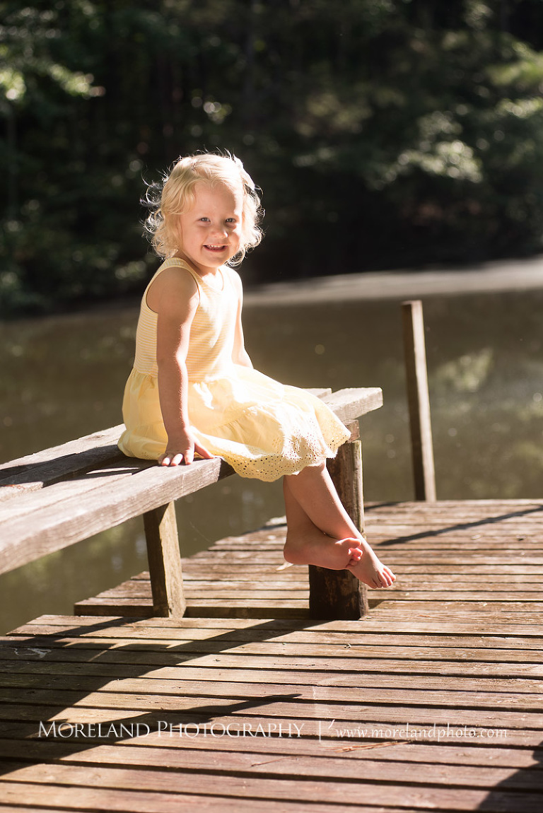 laughing girl on wooden bench by the lake, Mike Moreland, Moreland Photography, wedding photography, Atlanta wedding photography, detailed wedding photography, lifestyle wedding photography, Atlanta wedding photographer,