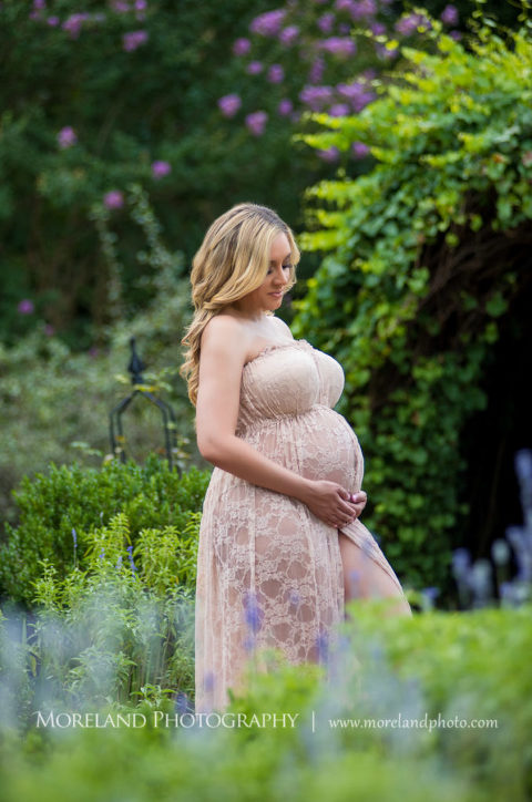 Pregnant woman standing in English garden wearing pink, flowy maternity dress, Mike Moreland, Moreland Photography, Atlanta Portrait Photographer, Maternity Photography Atlanta