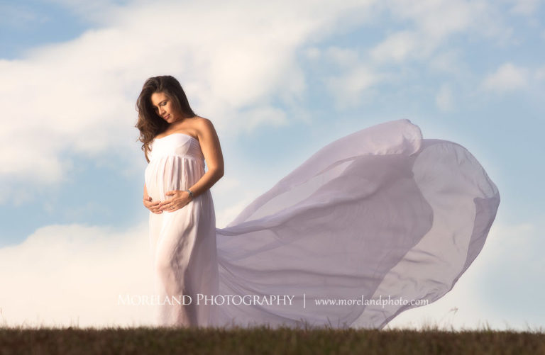 Pregnant mother holding her swollen belly in a white dress, Mike Moreland, Moreland Photography, Outdoor Photography, Atlanta Portrait Photographer, Maternity Photography Atlanta, New Born Photography, New Born Photography Atlanta, Baby, Downtown Atlanta, Family, Mother, 
