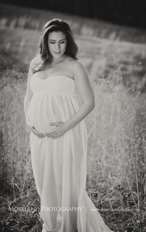 Pregnant mother holding her swollen belly in a white dress, Mike Moreland, Moreland Photography, Outdoor Photography, Atlanta Portrait Photographer, Maternity Photography Atlanta, New Born Photography, New Born Photography Atlanta, Baby, Downtown Atlanta, Family, Mother, 