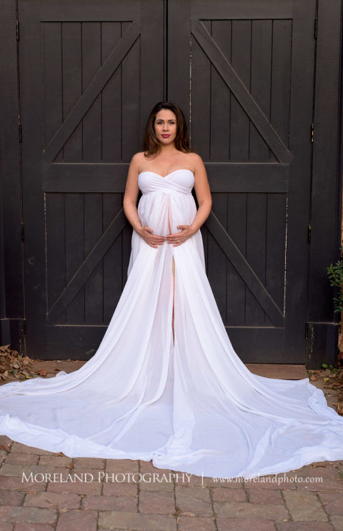 Maternity shoot of mother holding her exposed belly in white flowing dress, Mike Moreland, Moreland Photography, Atlanta Portrait Photographer, Maternity Photography Atlanta, New Born Photography, New Born Photography Atlanta, Baby, Downtown Atlanta, Family, Mother, White Maternity dress