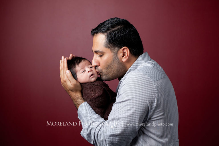 Photo of father kissing his new born baby, Mike Moreland, Moreland Photography, Atlanta Portrait Photographer, Maternity Photography Atlanta, New Born Photography, New Born Photography Atlanta, Baby, Downtown Atlanta, Family, Mother, Father, 