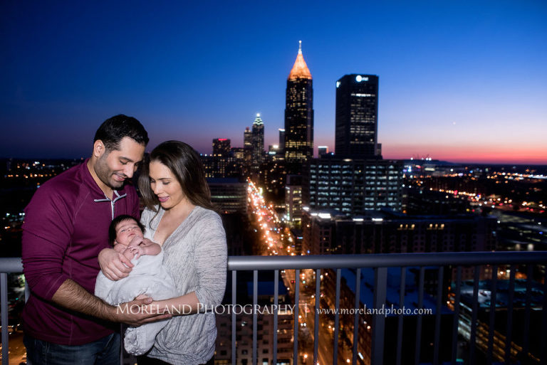Mother and father with new born baby with Atlanta city skyline in background, Mike Moreland, Moreland Photography, Atlanta Portrait Photographer, Maternity Photography Atlanta, New Born Photography, New Born Photography Atlanta, Atlanta Skyline, Downtown Atlanta, Mother, Father, Baby, New born, Sunset, City skyline,