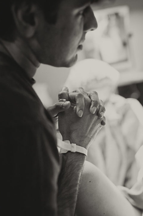 Close up of father clasping hands together, Mike Moreland, Moreland Photography, Birth Photography, Atlanta Portrait Photographer, Photography Atlanta, New Born Photography, New Born Photography Atlanta, Baby, Family, Mother, Father, Little Moment Photography, Black and white photography, 