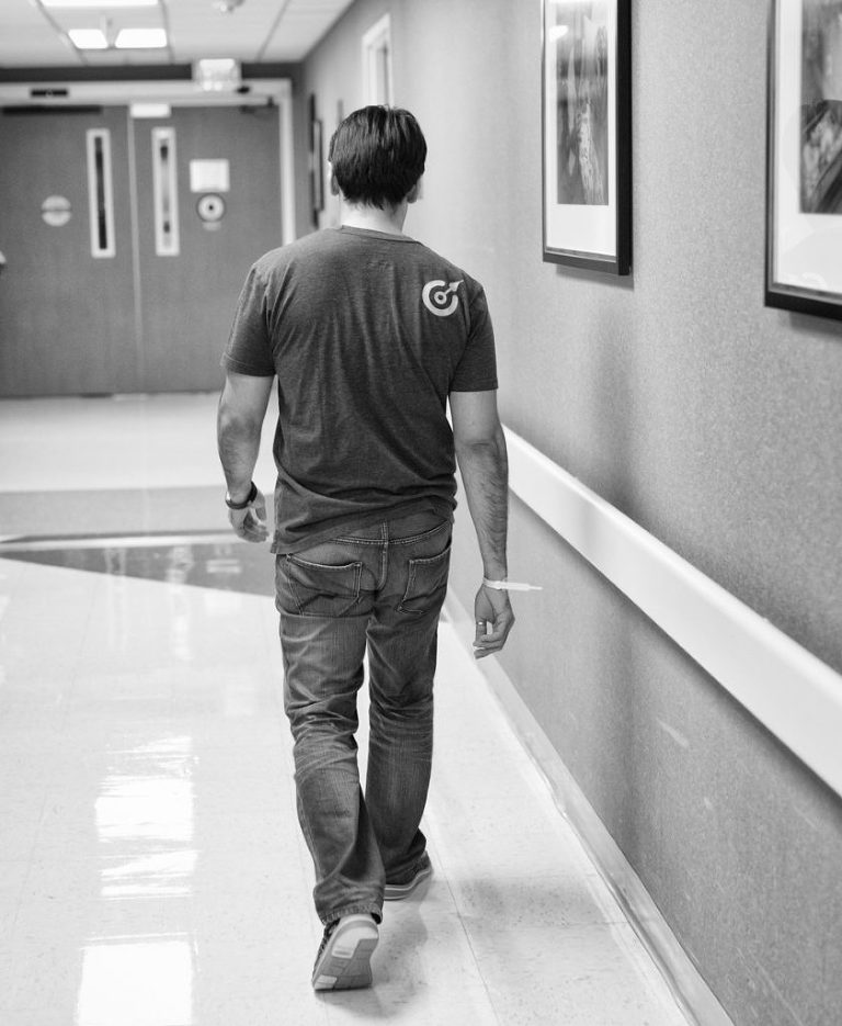 New father walking back to see his family, Mike Moreland, Moreland Photography, Birth Photography, Atlanta Portrait Photographer, Photography Atlanta, New Born Photography, New Born Photography Atlanta, Baby, Family, Mother, Father, Little Moment Photography, Black and white photography, Baby Boy