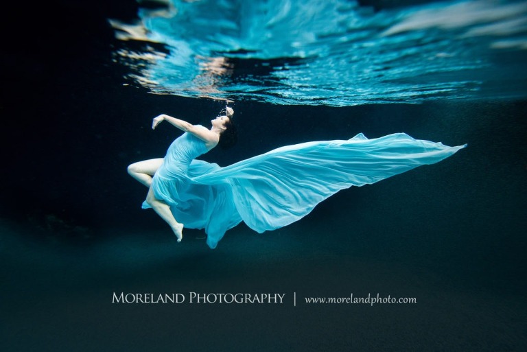 woman underwater in light blue dress moving gracefully, adult underwater photograhy, underwater portraits, portrait photography atlanta, moreland photography, florida underwater portraits, underwater photography, nikon, atlanta photography, atlanta fashion